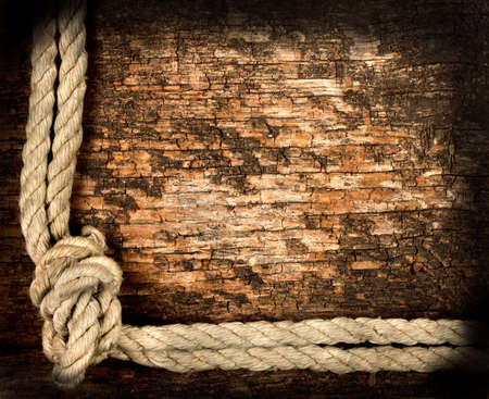 Background of old dried rough planks with ropeの写真素材
