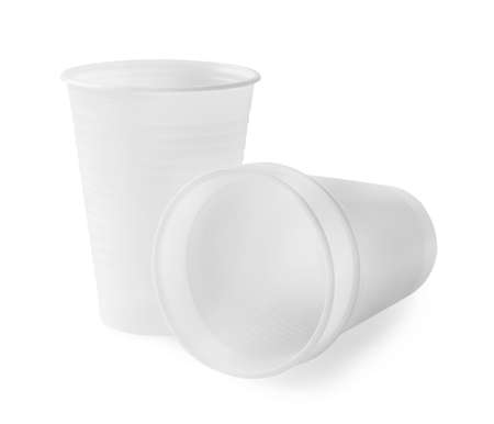 Three empty plastic cups isolated on white backgroundの写真素材