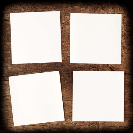Four clean white sheet on wooden backgroundの写真素材