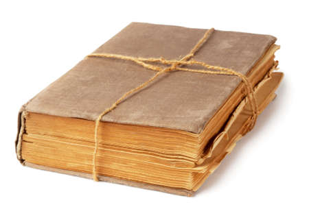 Old book tied with a rope isolated on white backgroundの写真素材