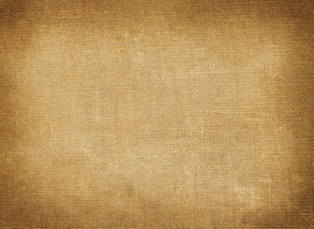 Background of brown coarse textile with tinted edgesの写真素材