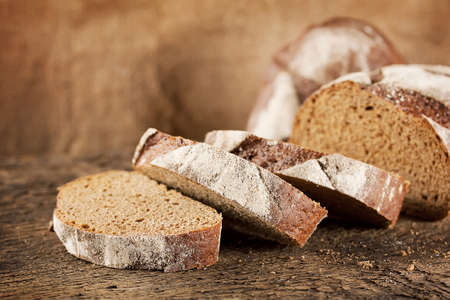 Loaf of black rye bread with sliced