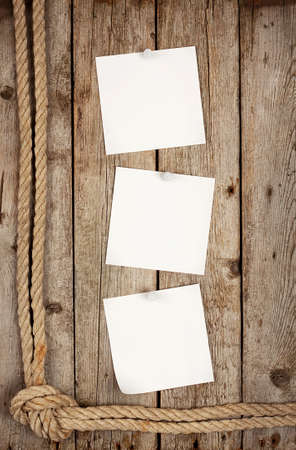 Three white sticker attached buttons on the boardsの写真素材
