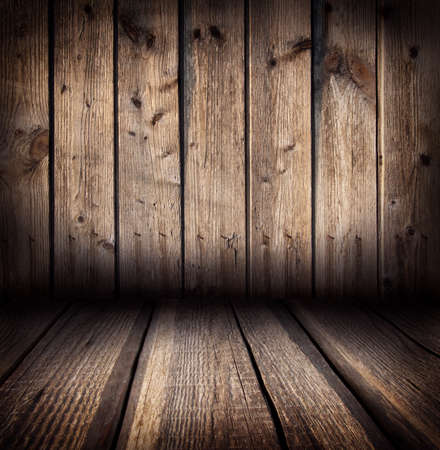 Background of rough wooden planks adjacent to the wallの写真素材