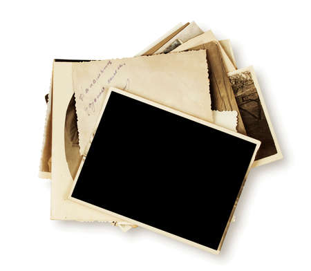 Stack of old photographs isolated on white backgroundの写真素材