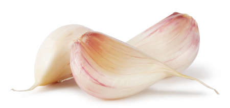 Three cloves of raw garlic isolated on white backgroundの写真素材