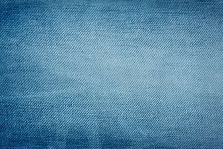 Blue denim background of rough cloth