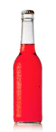 Bottle of red cocktail with drops isolated の写真素材