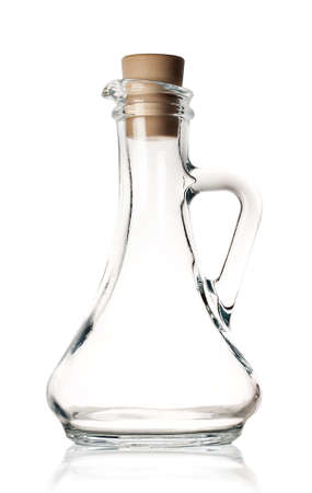 Transparent glass carafe with a cork isolated on white backgroundの写真素材