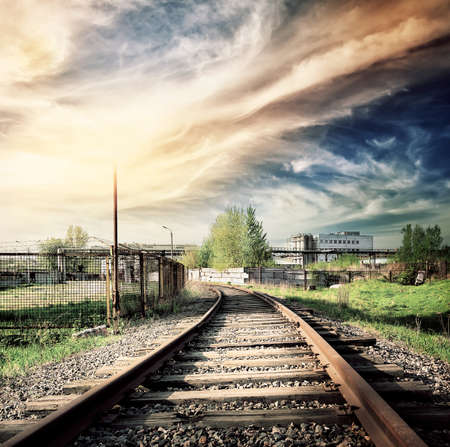 Old rusty railroad leading to the industrial zoneの写真素材