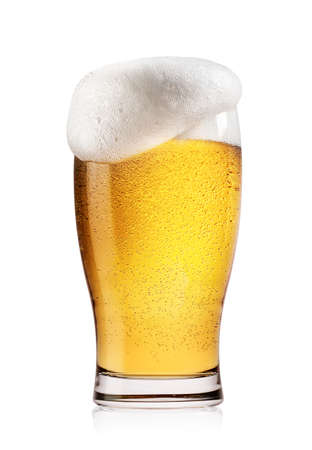 Glass of light beer with white foam isolated on white backgroundの写真素材