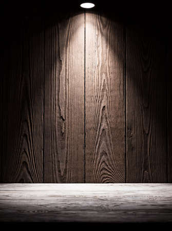 Background texture of wooden boards with illumination from aboveの写真素材