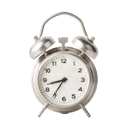 Old metal alarm clock isolated on white background
