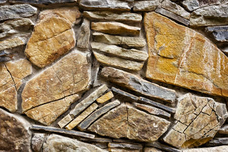 Background of hewn stone stacked in a wall