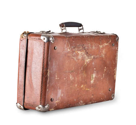 Old brown suitcase with handle isolated on white backgroundの写真素材