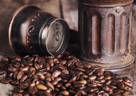 Coffee and grinder on wooden table stylized old photo