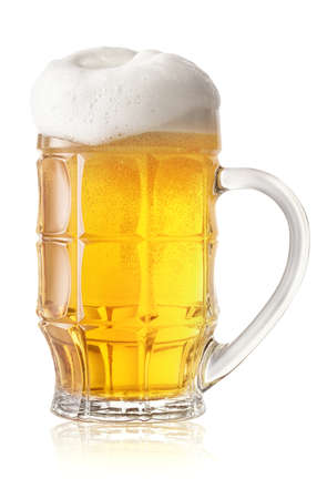 Light beer glass with thick white foam isolated on white backgroundの写真素材