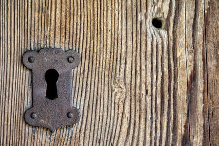 Background from old boards with keyhole and a holeの写真素材