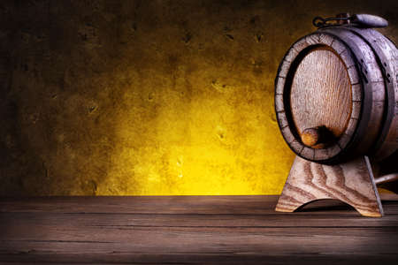 Wooden barrel with stand on yellow gradient background
