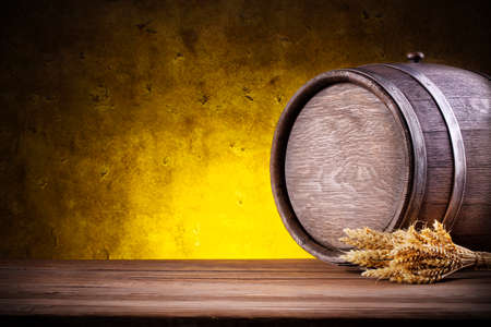 Wooden round barrel with spikes on yellow gradient backgroundの写真素材