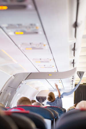 Boy changeover button in the cabin shot from behindの写真素材