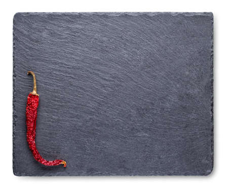 Dry red pepper on slate blackboardの写真素材