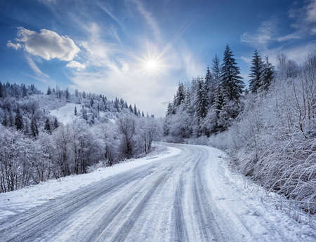 Road in the mountains covered with snowの写真素材
