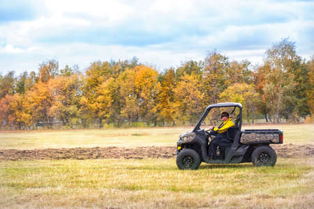 Hunting quad bike with driver in mask