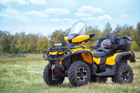 Yellow ATV and helmetの写真素材