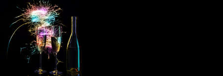 Champagne in the festive sparks of colored Bengal lights