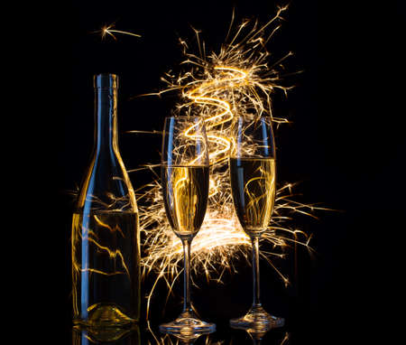 Festive champagne in the sparks of lightsの写真素材