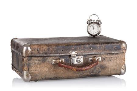 Ancient leather suitcase with clockの写真素材