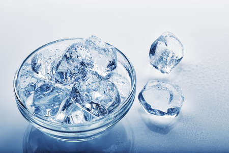 Frozen ice cubes in  glass plateの写真素材