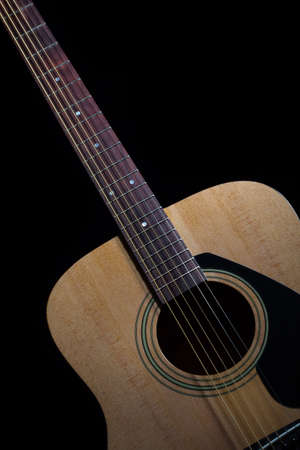 Guitar acoustic on black backgroundの写真素材