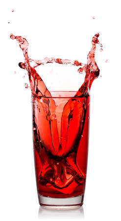 Splash of natural cherry juice in transparent glassの写真素材