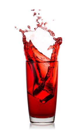 High glass with splash of natural cherry juiceの写真素材