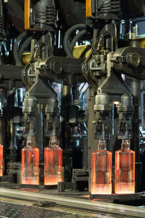 Hot rolled ribbed bottles on the conveyor