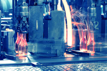 Conveyor with the hot glass bottlesの写真素材