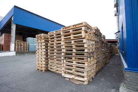 Row of wooden pallets in the stockの写真素材