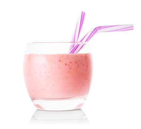 Glass of berry smoothie or yogurt with strawsの写真素材