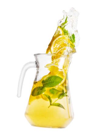 Jug with spilling homemade lemonadeの写真素材