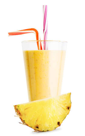 A glass of pineapple smoothie or yogurt with pineapple sliceの写真素材