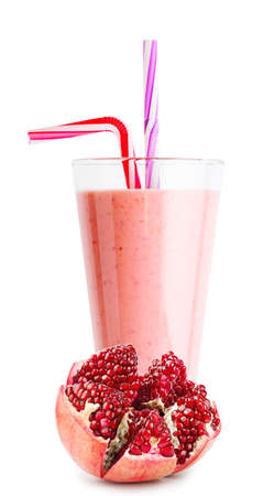 Pomegranate smoothie or yogurt in glass and peeled pomegranateの写真素材