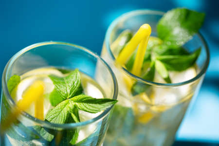 Fragments of glasses of homemade lemonade with mintの写真素材