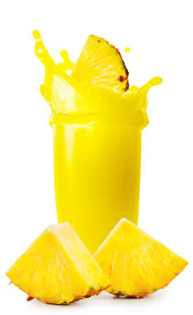 Pineapple juice with splash of slices and sliced pineappleの写真素材