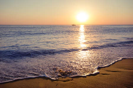 Sandy beach at sunsetの写真素材