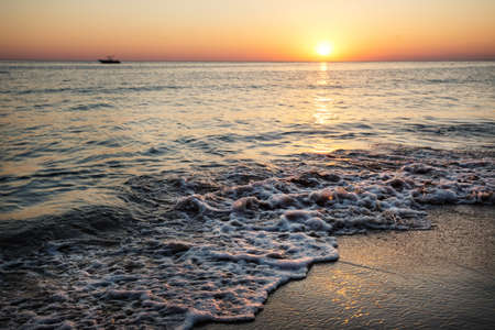 Seashore at sunsetの写真素材