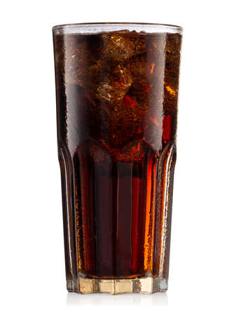 Brown carbonated drink in steaming glass with iceの写真素材