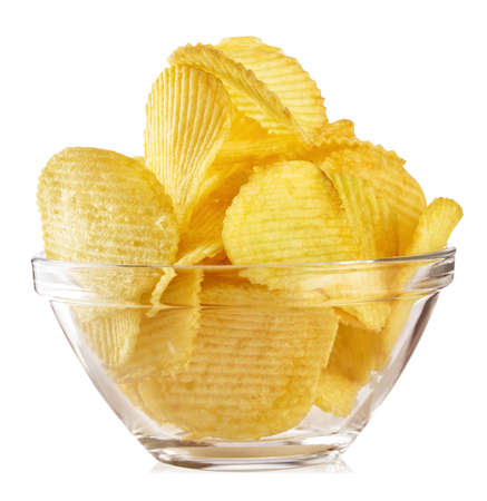 Crispy wavy chips in transparent plateの写真素材