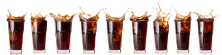 Splash of cola in a glassの写真素材